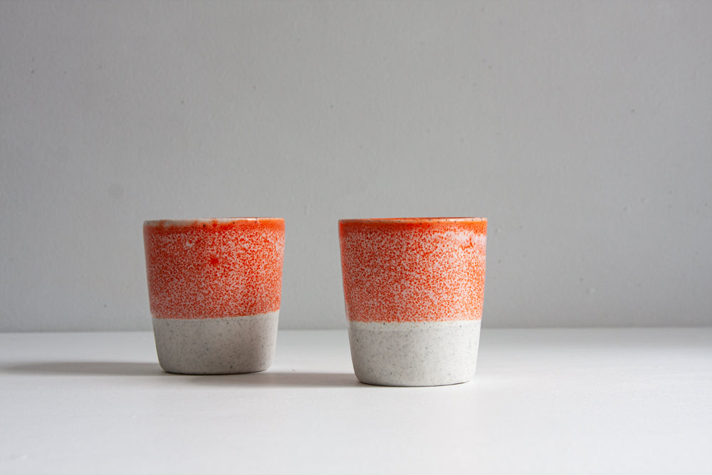 handmade ceramic orange tumbler cup