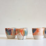 handmade ceramic orange, blue and brown cup