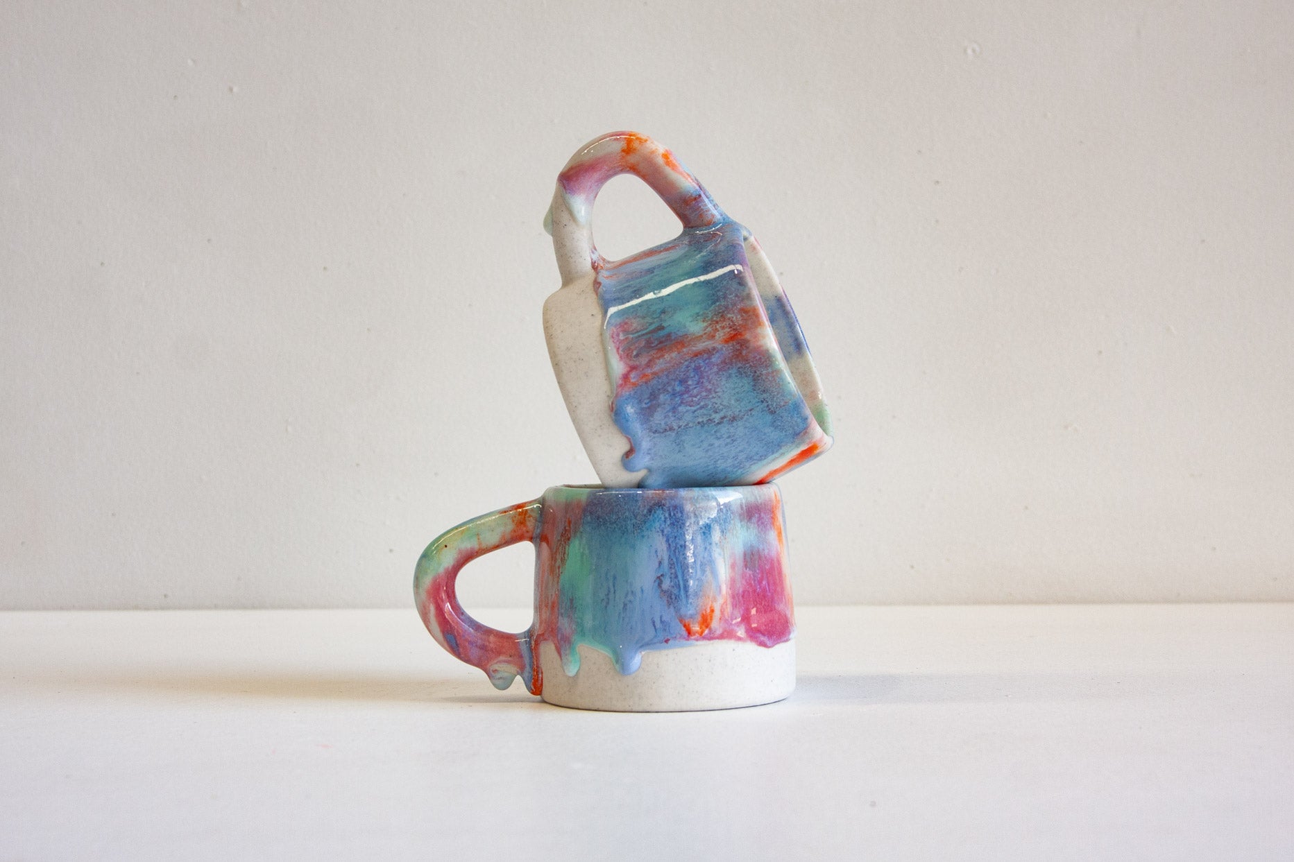 handmade ceramic pink, blue, green and orange mug