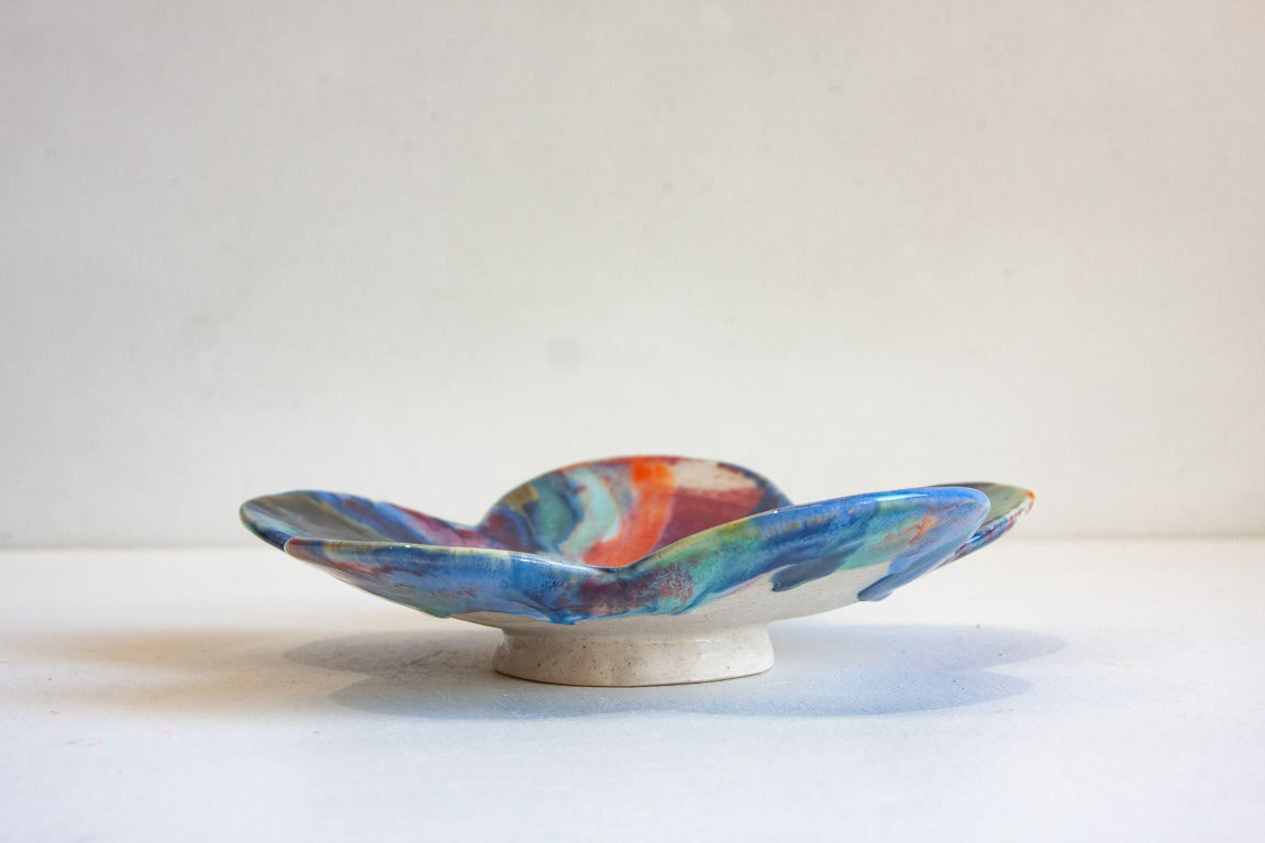 handmade ceramic blue, orange, purple flower shaped footed bowl