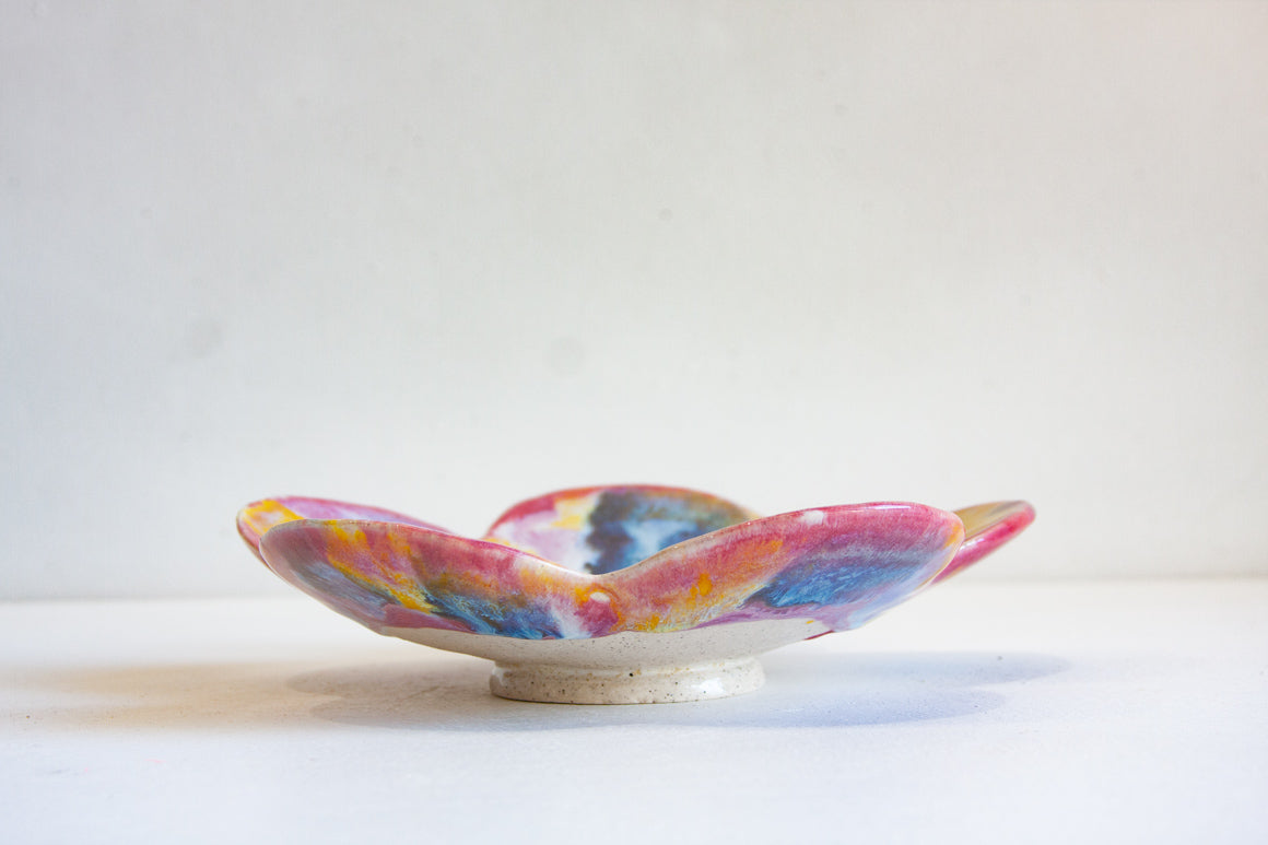 handmade ceramic pink, blue and yellow footed flower shaped bowl