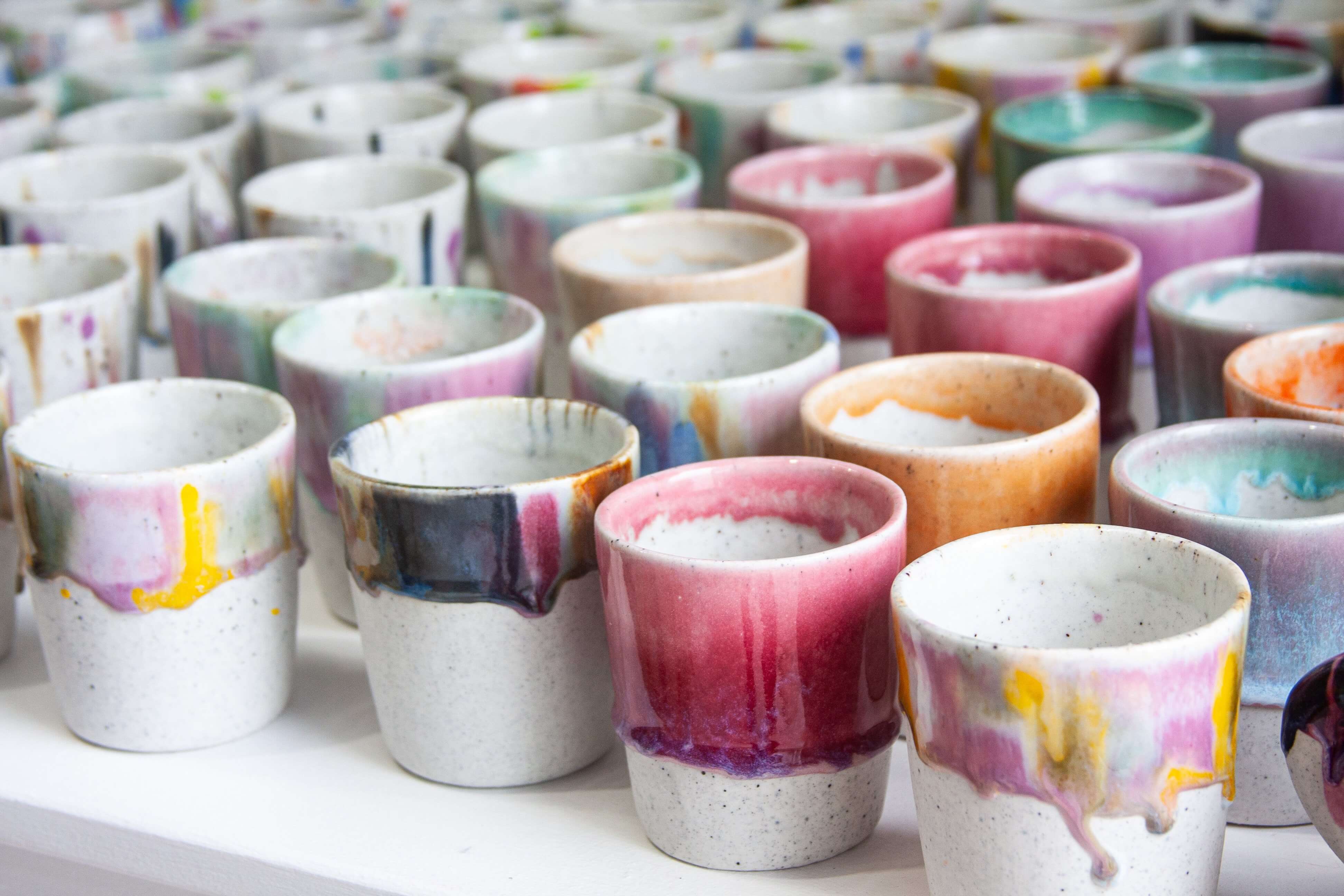 handmade ceramic cups in bright coloured glaze