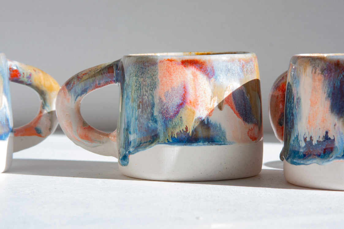 handmade ceramic blue, orange, brown and white ceramic mug