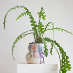 handmade ceramic rounded planter, glazed in ruby reds and deep blues.