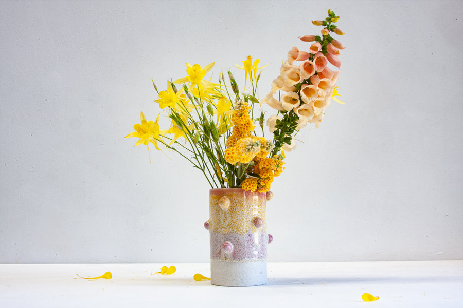 handmade ceramic yellow and pink cylinder vase with bauble decoration