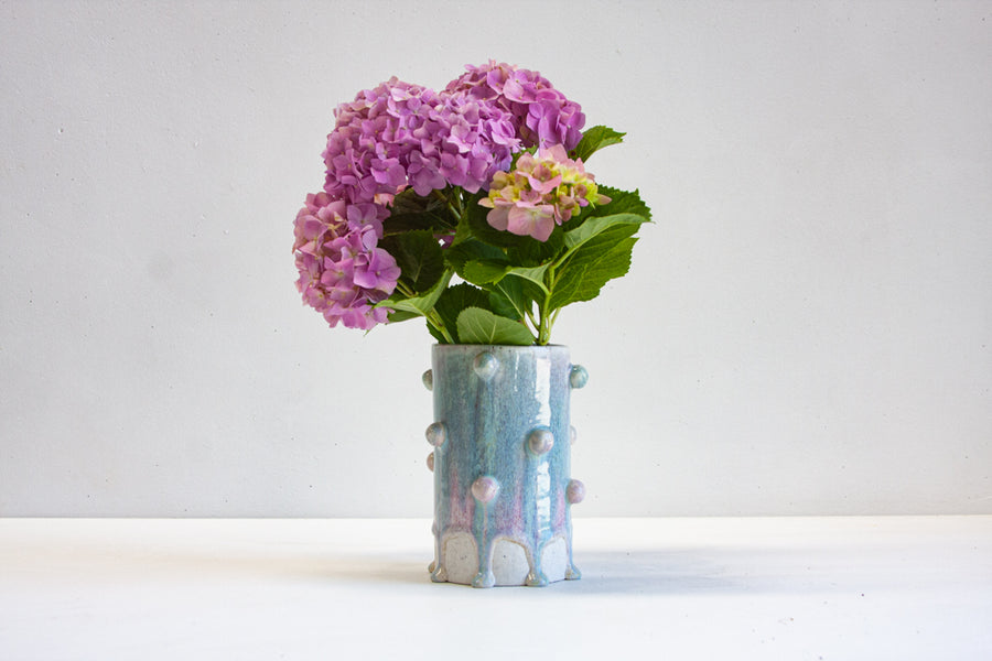 handmade ceramic purple and blue cylinder vase with little bauble decoration
