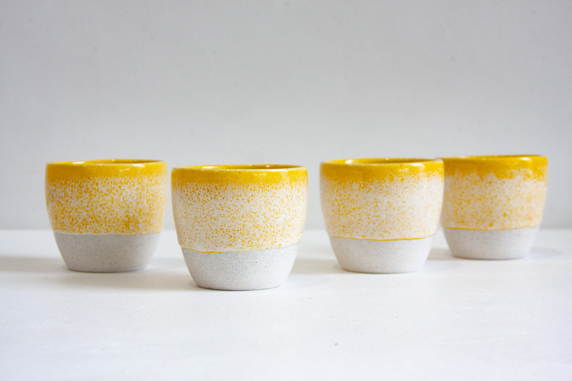 ceramic cups glazed in yellow
