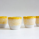 ceramic cups glazed in yellow