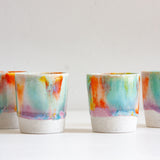 handmade ceramic espresso cup glazed in purple, green, yellow and orange