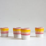 handmade ceramic espresso cup glazed in yellow and pink