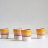 handmade ceramic espresso cup glazed in yellow and pink