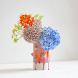 Vase with decorative clay ball glazed in orange and purple