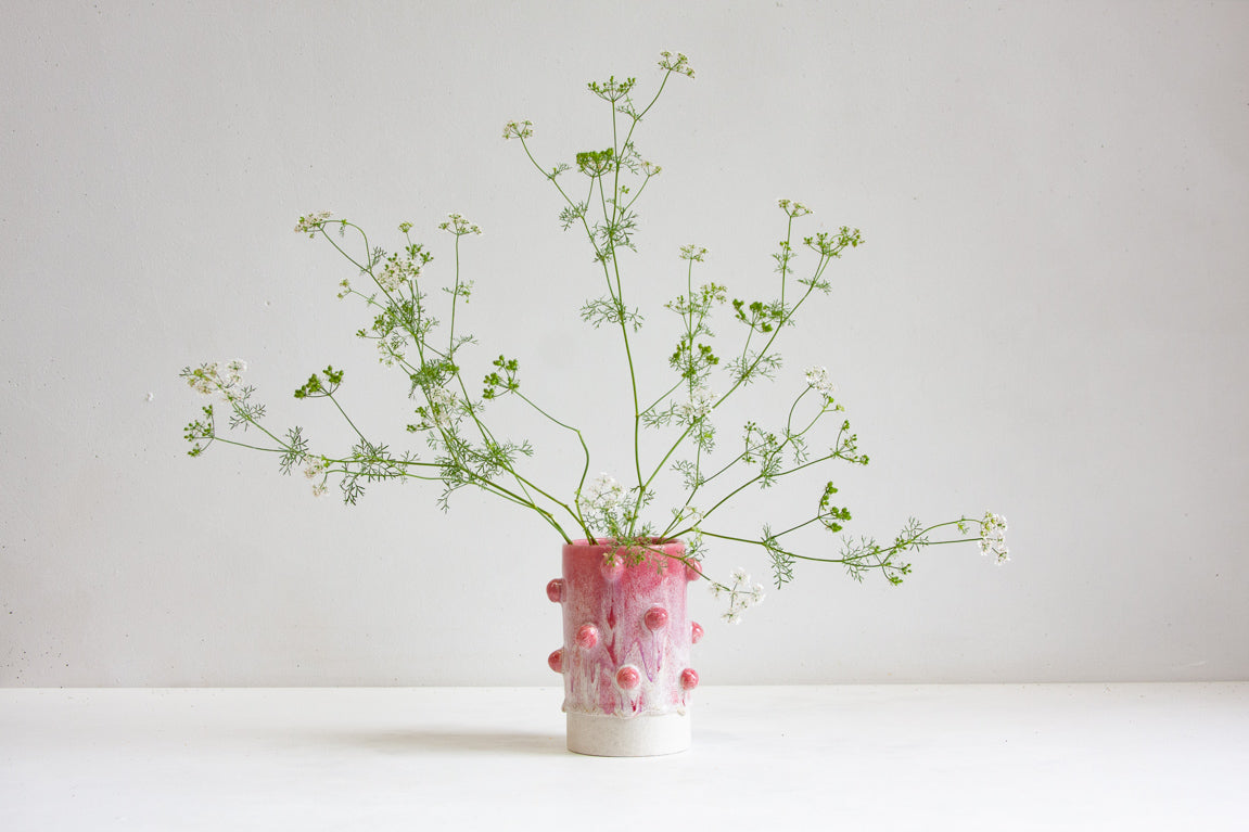 vase with sculptural decorative clay balls glazed in pink