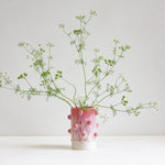 vase with sculptural decorative clay balls glazed in pink