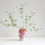 vase with sculptural decorative clay balls glazed in pink