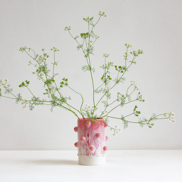 vase with sculptural decorative clay balls glazed in pink