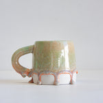 handmade ceramic green and peach mug