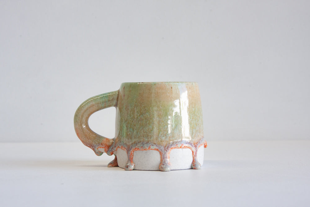 handmade ceramic green and peach mug