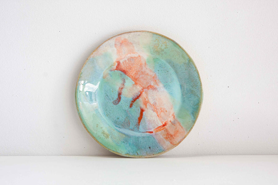 handmade ceramic plate, glazed in greens, blues and oranges.