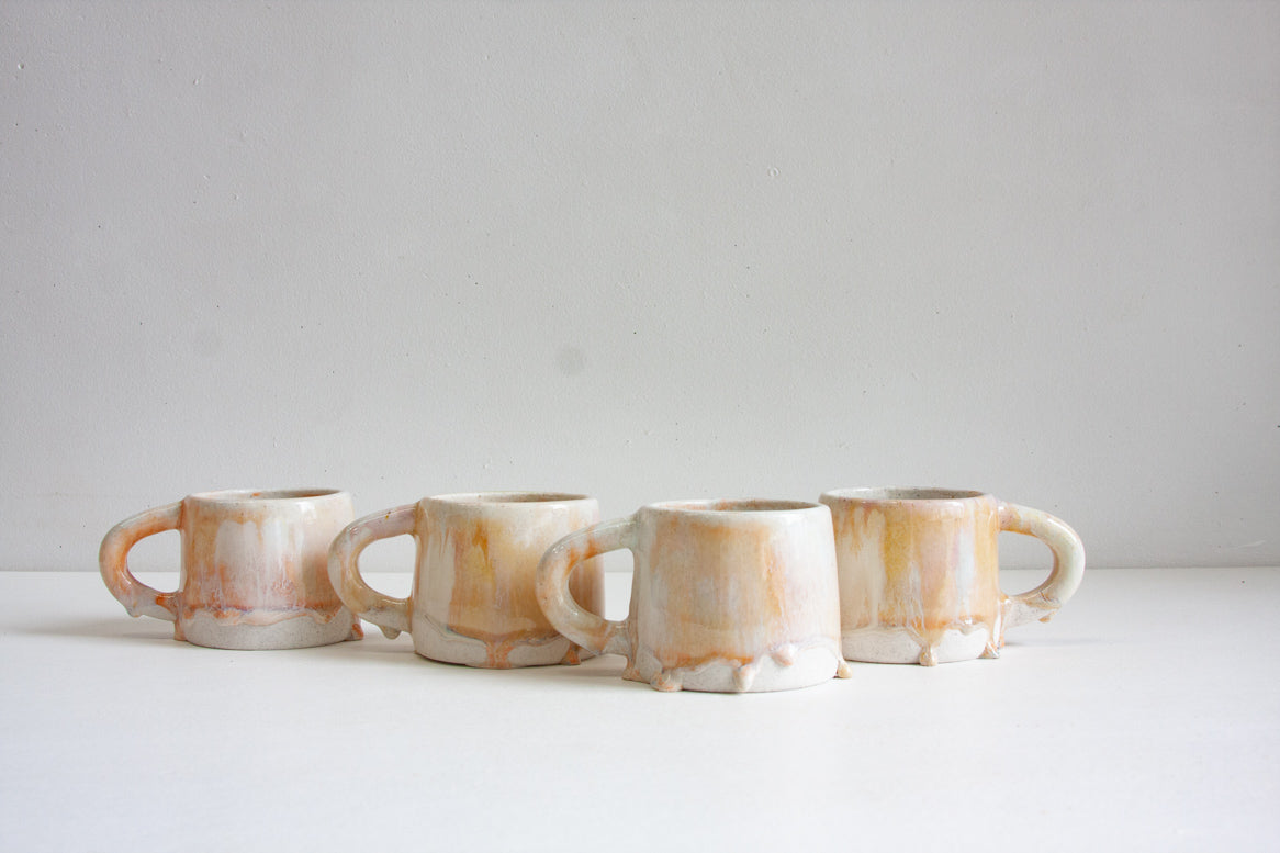 handmade ceramic mug glazed in soft pink and cream