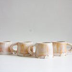 handmade ceramic mug glazed in soft pink and cream