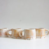 handmade ceramic mug glazed in soft pink and cream
