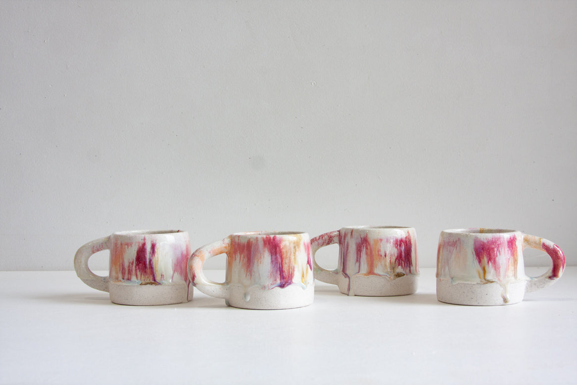 handmade ceramic mug glazed in pinks, peach, white and brown