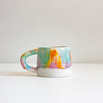 handmade ceramic purple, green, orange and yellow mug 