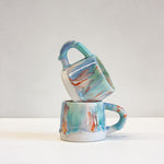 handmade ceramic blue, green, orange light purple mug
