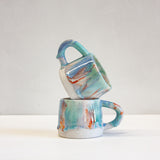 handmade ceramic blue, green, orange light purple mug