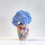 handmade ceramic vase glazed in pink, brown, peach and blue