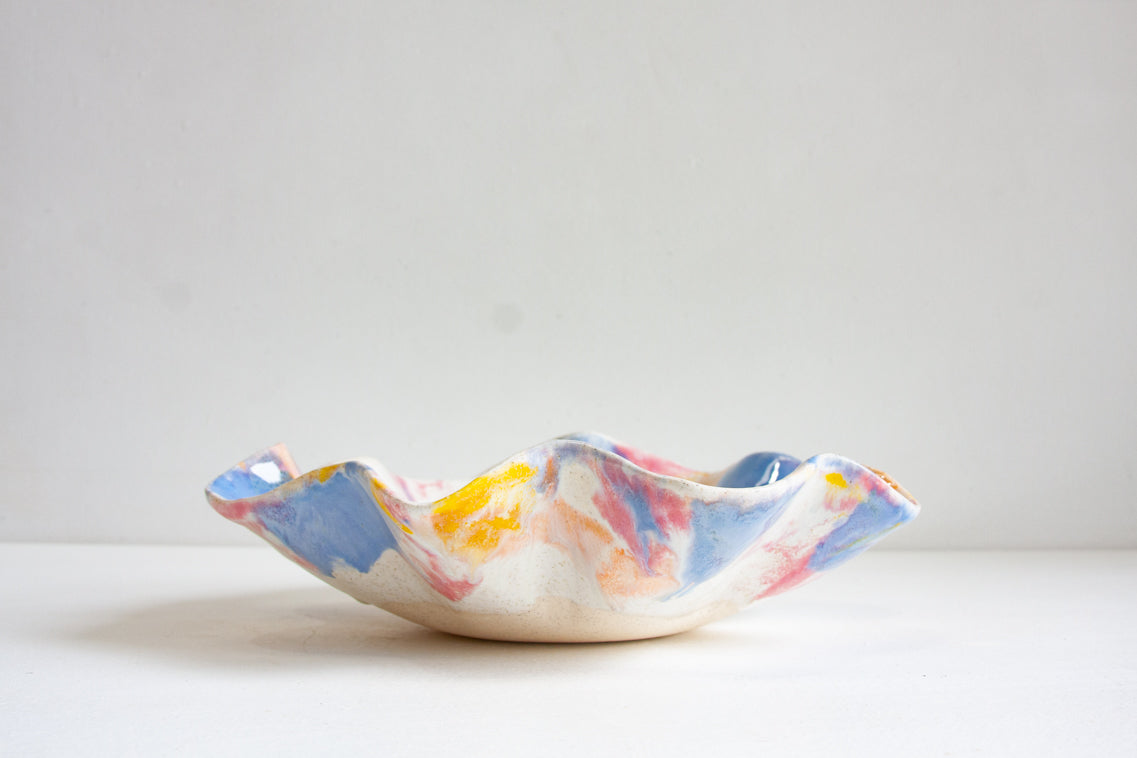 Handmade ceramic pink, peach, yellow, blue and white oyster shaped platter