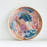 handmade ceramic deep plate glazed in blue, brown and pink