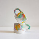 handmade ceramic green, orange, yellow and purple mug