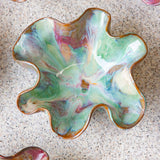 handmade ceramic dark clay oyster shaped bowl glazed in pinks and greens