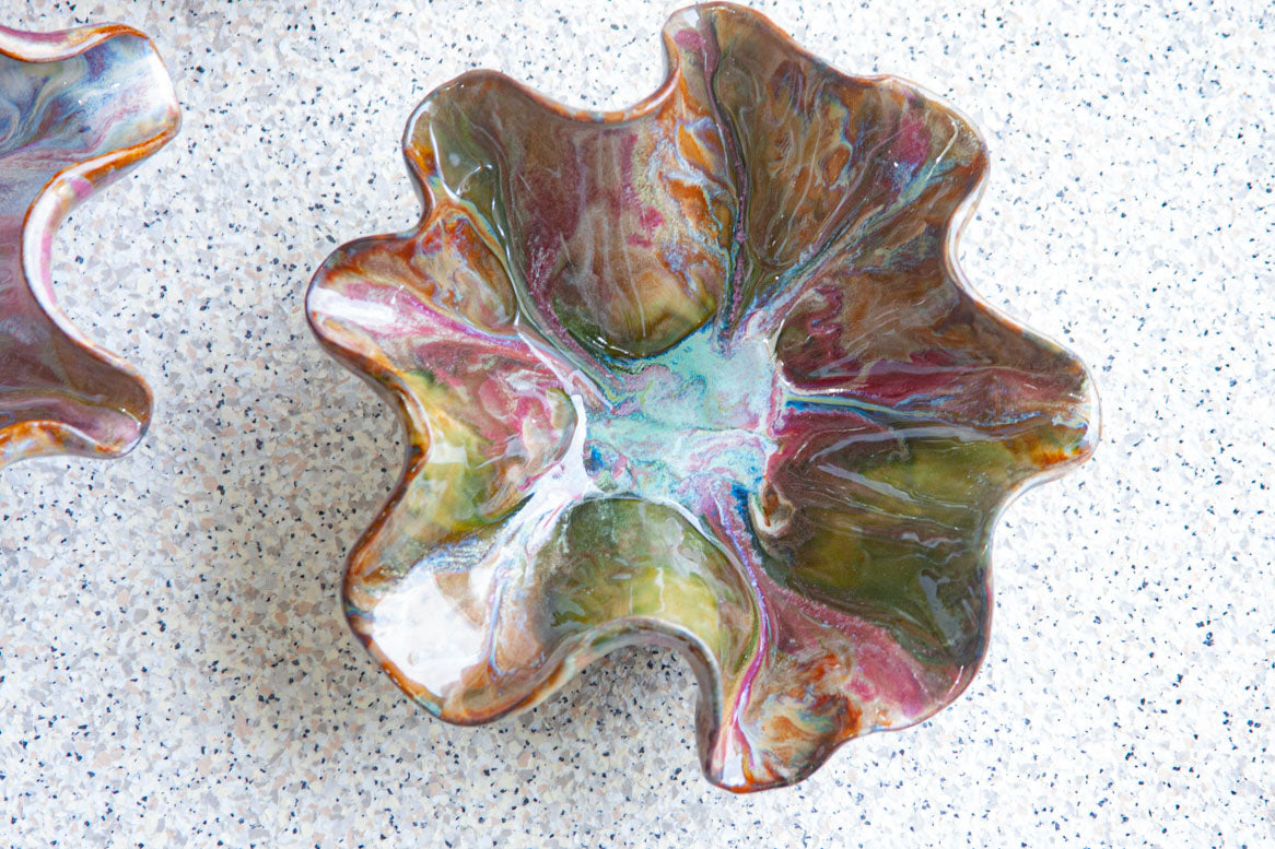 handmade ceramic dark clay oyster shaped bowl glazed in dark green, blue, dark pink and brown