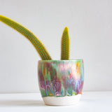 handmade ceramic planter glazed in pink, green, peach, brown