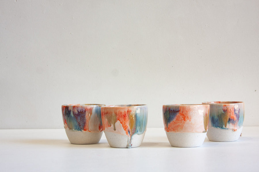 handmade ceramic orange, blue and brown cup
