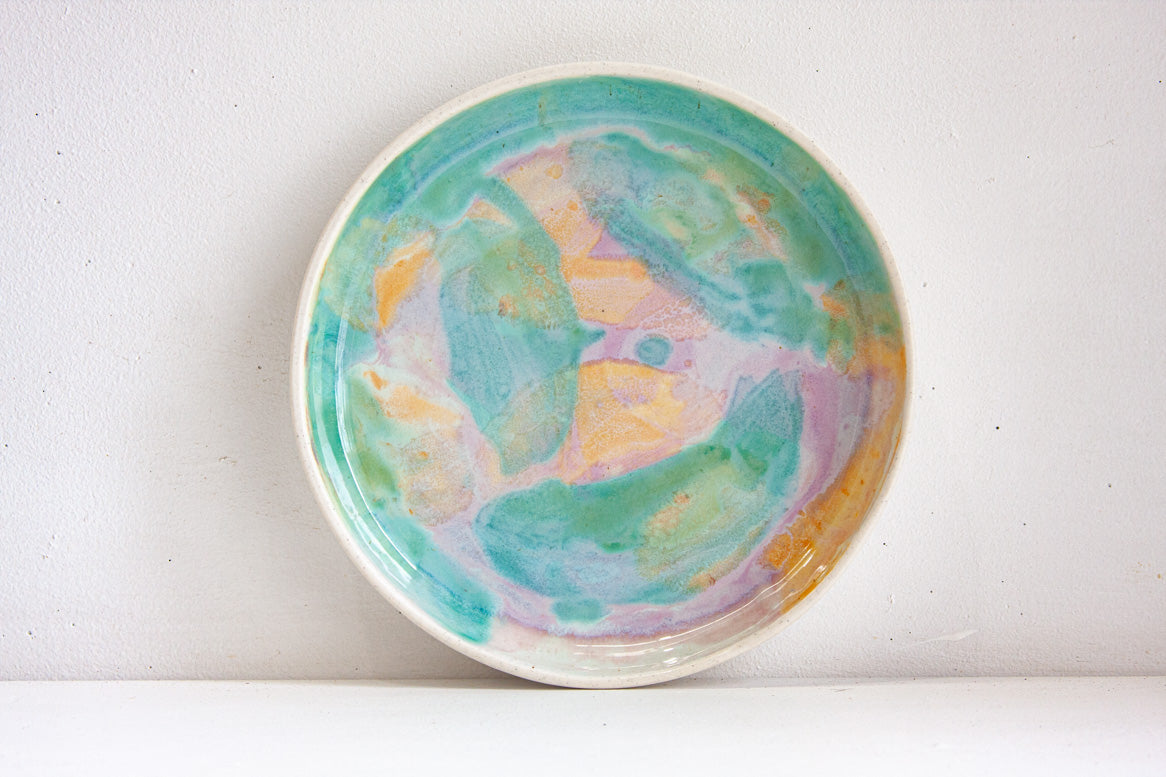handmade ceramic deep plate glazed in green, purple and peach