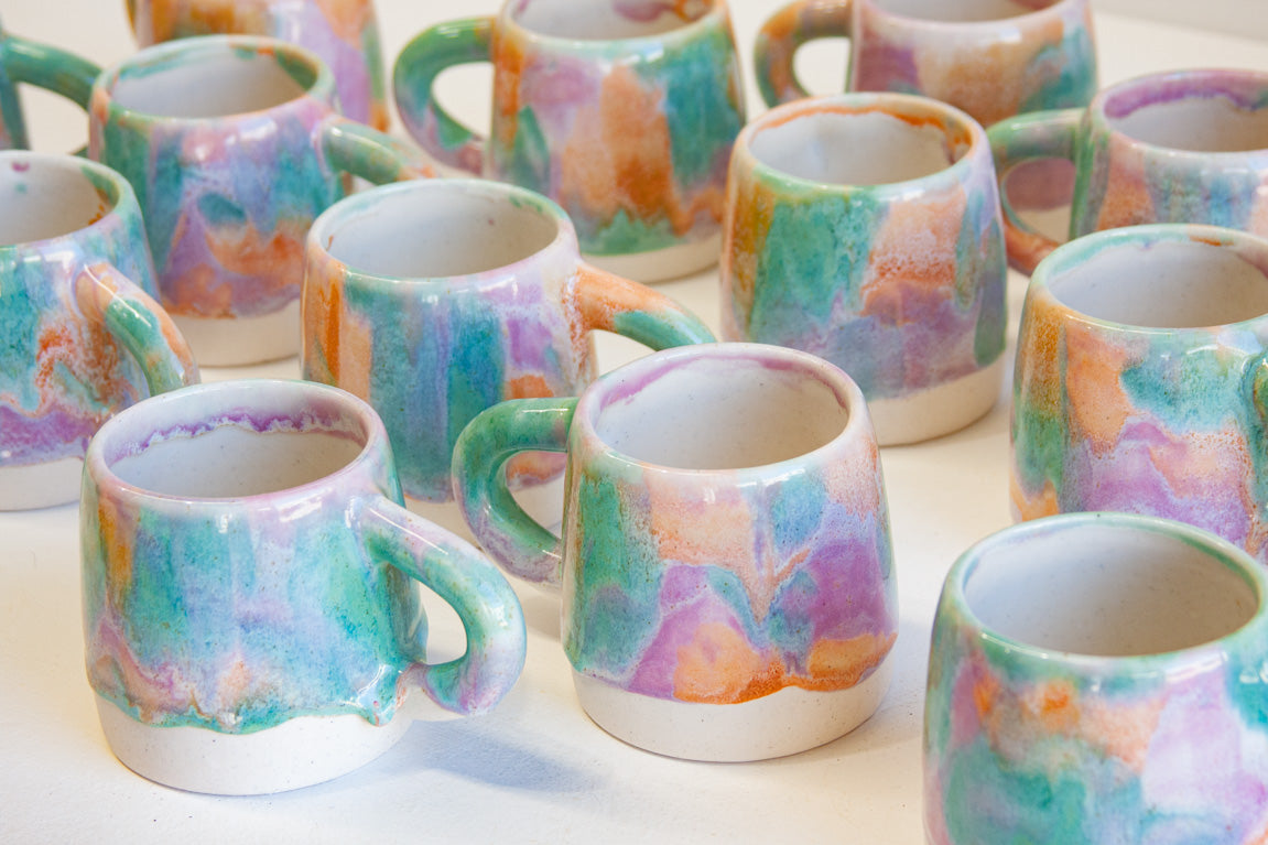 group of handmade ceramic purple, green and peach large mugs