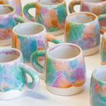 group of handmade ceramic purple, green and peach large mugs