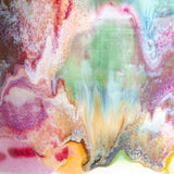 Extreme close-up of the glaze surface showing multicolour paint-pour detail in purple, amber, green, teal, pink and red