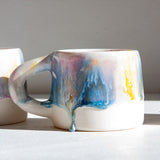 handmade ceramic purple, yellow, peach and blue mug
