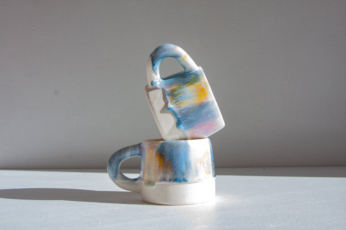 handmade ceramic purple, yellow, peach and blue mug