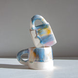 handmade ceramic purple, yellow, peach and blue mug