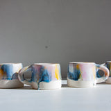 handmade ceramic purple, yellow, peach and blue mug
