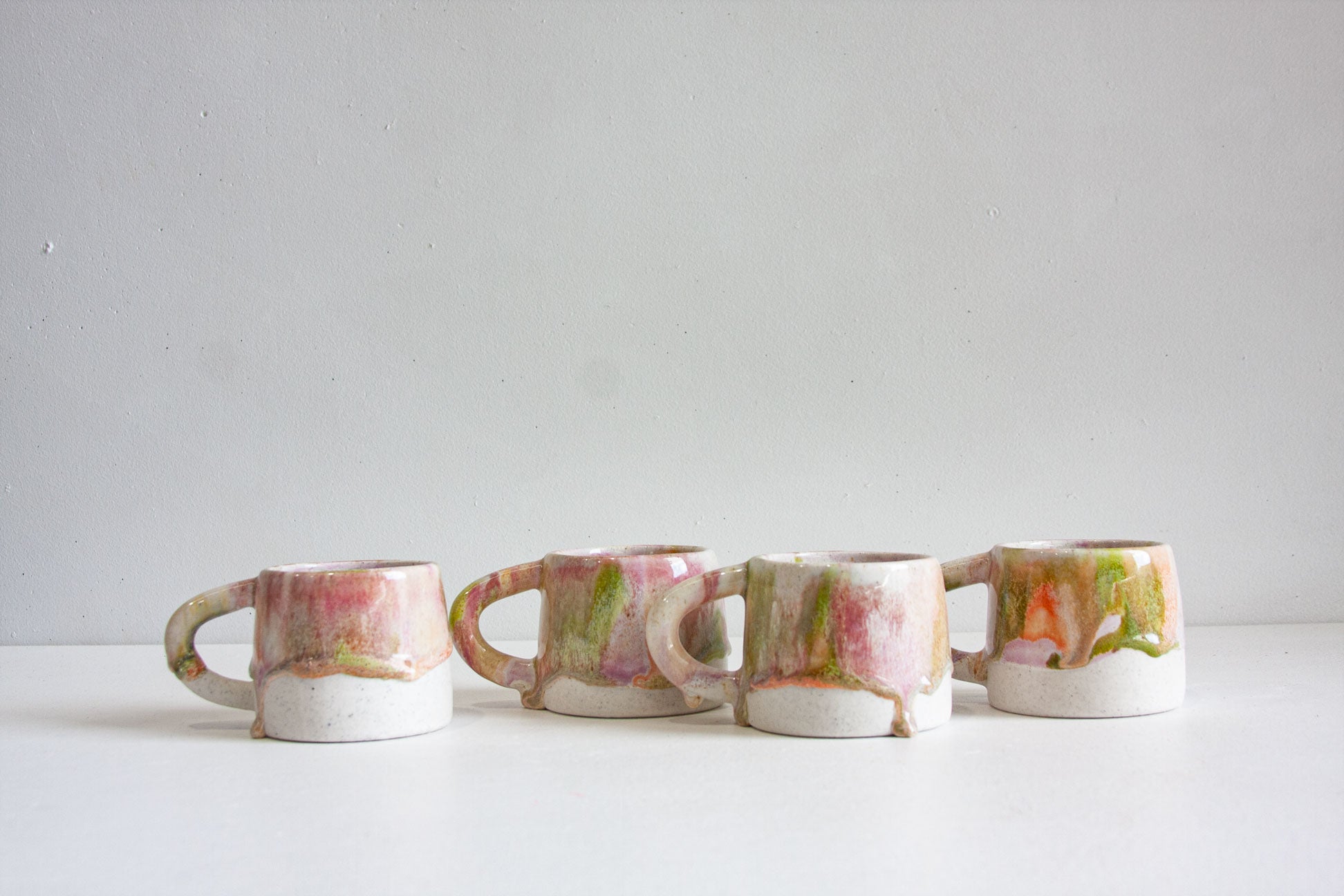 handmade ceramic green, pink, peach mug