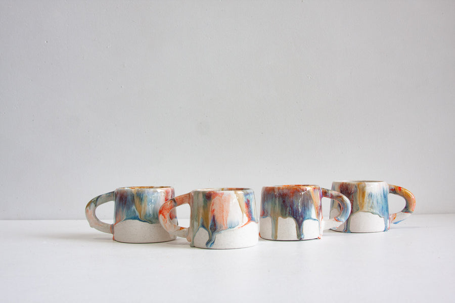 handmade ceramic orange, blue and brown mug
