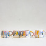Handmade ceramic yellow, blue, purple and white mug 