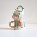handmade ceramic green, orange, purple and brown mug